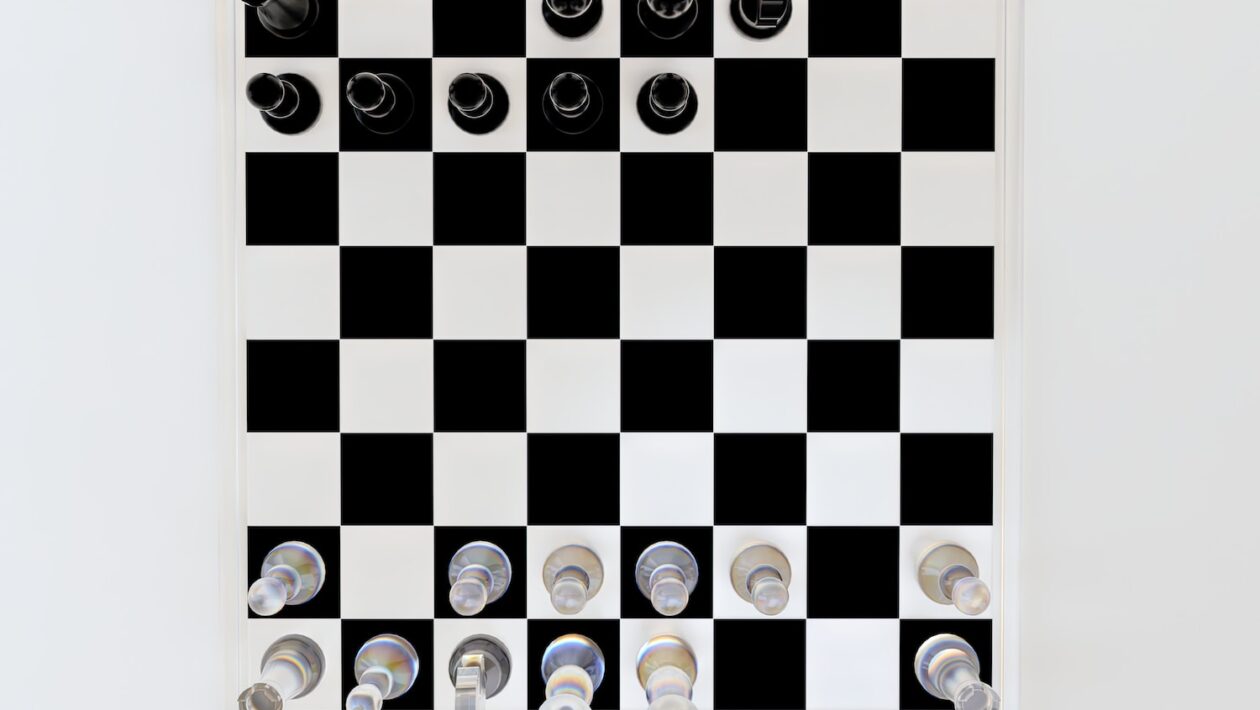 a black and white checkered board with buttons on it