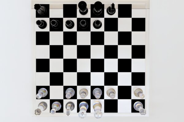 a black and white checkered board with buttons on it