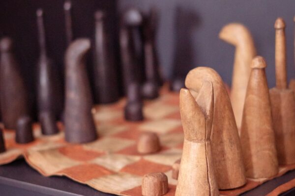 brown wooden rolling pin on brown wooden board