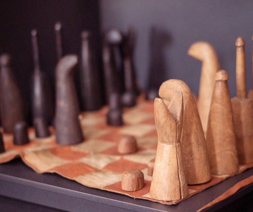 brown wooden rolling pin on brown wooden board