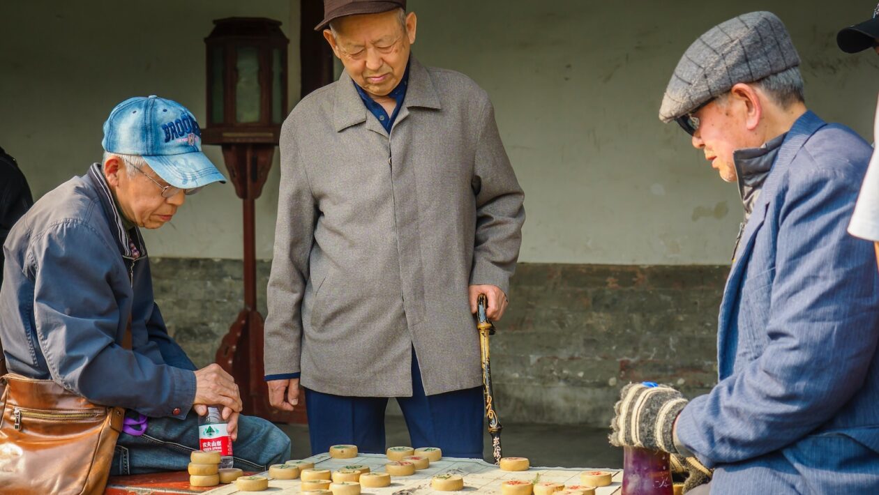 a group of men playing a game of checkers